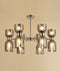 CLA CLESSIDRA: Interior Mirror Finish Smokey Black / Opal Glass Ellipse x12 Round Base Pendant Lights