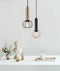 CLA CORAZON: Interior Matte Black and Copper Cage Diamond Pendant Light
