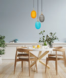 CLA KATHAL: Interior Ellipse Glass Segmented with Brass Highlight Enclosed Pendant Lights