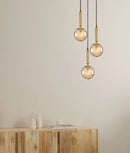 CLA TRATTINO: Interior Bronze Amber / Smokey Black Spherical Glass Multiple Round Base Pendant Lights